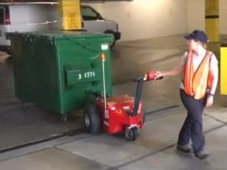 v move XL dumpster mover tug 400x300 1 1 v-move xl+ dumpster mover tug pulling 3-yard bin. Also called a waste bin tug | Xerowaste
