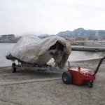 V-Move XL battery-powered tug or load mover moving a boat and trailer on a beach | Xerowaste.ca