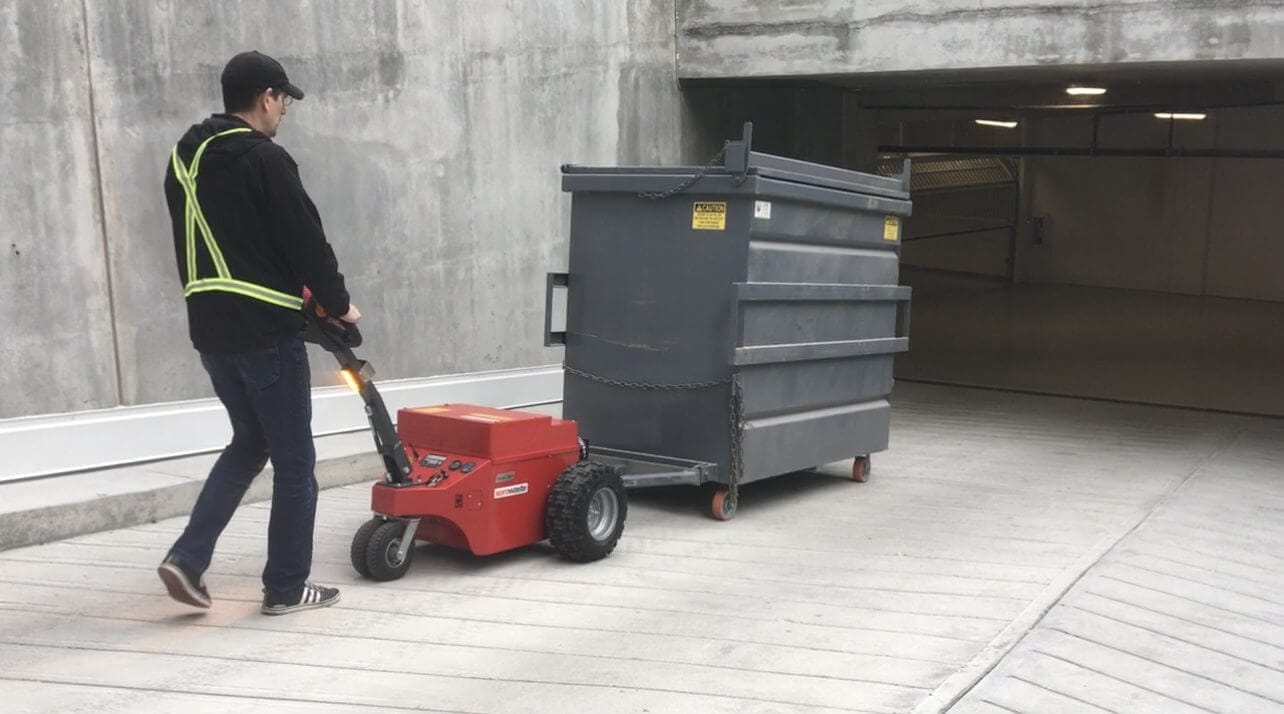 V-move XL+ dumpster mover tug on a driveway. Also called a waste bin tug | Xerowaste.ca