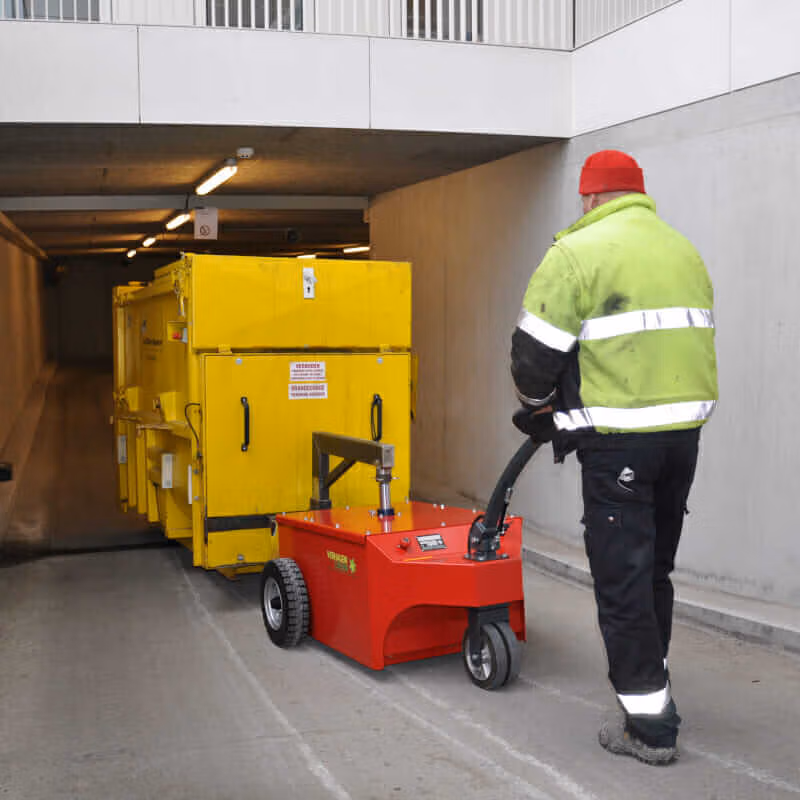 Xerowaste | V-move XXL moving self-contained compactor on slope-800x800 Xerowaste | V-move XXL dumpster mover pulling self-contained compactor up driveway slope