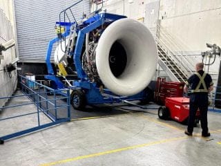 Xerowaste | V-move XXL load mover tug with high-capacity all-season air tires and only 400 kg/882 lb added counterweight moving a 26,000 lb commercial aircraft engine in Vancouver BC.